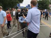 Journalists on leash (Breitbart News / Unknown)