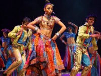 Indian dancers perform on May 19, 2008 during 'The Merchants of Bollywood', a dance play based on a true life story, presented at the Theatre of Dance at Durban's International Convention Centre in Durban. Featuring a cast of 40 singers and dancers is set in songs and music from Bollywood films, the world's largest film industry. The dance theatrical has performed in Germany, Australia, the United Kingdom and other countries worldwide. AFP PHOTO/RAJESH JANTILAL (Photo credit should read RAJESH JANTILAL/AFP/Getty Images)