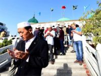 Chinese Muslims gather at the Nan Guan mosque for the Eid morning prayers during the sacrificial Eid al-Adha festival in Yinchuan, northern China's Ningxia province on September 24, 2015. Muslims across the world celebrate the annual festival of Eid al-Adha, or the Festival of Sacrifice, which marks the end of the Hajj pilgrimage to Mecca and in commemoration of Prophet Abraham's readiness to sacrifice his son to show obedience to God. AFP PHOTO / GOH CHAI HIN (Photo credit should read GOH CHAI HIN/AFP/Getty Images)