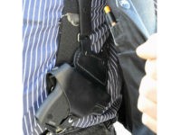 FILE - In this Jan. 2, 2012 file photo, a small handgun is seen under a vest in High Point, N.C. Dealing a blow to gun supporters, a federal appeals court ruled Thursday, June 9, 2016, that Americans do not have a constitutional right to carry concealed weapons in public. (Sonny Hedgecock/The Enterprise via AP, File) MANDATORY CREDIT