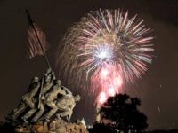The United States Marine Corps War Memorial, better known as the Iwo Jima Memorial, is seen in Arlington, Va., Monday July 4, 2011, as fireworks burst over Wasington, during the annual Fourth of July display. (AP Photo/Carolyn Kaster)