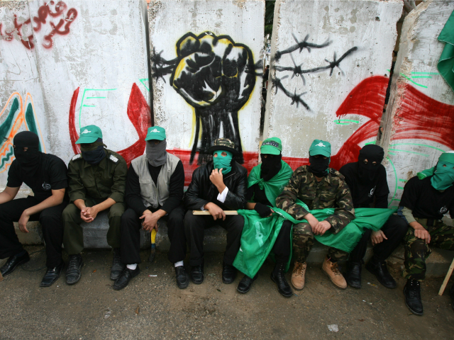 Palestinian Hamas supporters attend the funeral of militants killed during fire exchange against Israeli forces the previous day in the central Gaza Strip refugee camp of Maghazi, 21 December 2007.