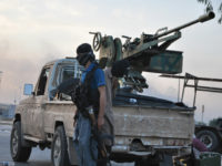 Fighters of Islamic State stand guard at a checkpoint in the northern Iraq city of Mosul, June 11, 2014. REUTERS