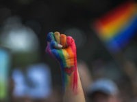 LOS ANGELES, CA - JUNE 13: A defiant fist is raised at a vigil for the worst mass shooing in United States history on June 13, 2016 in Los Angeles, United States. A gunman killed 49 people and wounded 53 others at a gay nightclub in Orlando, Florida early yesterday morning before suspect Omar Mateen also died on-scene. (Photo by David McNew/Getty Images)