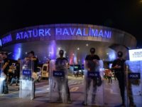 Turkish police officers block the main entrance of the Ataturk airport in Istanbul on June 28, 2016