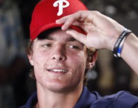 La Costa Canyon baseball player Mickey Moniak puts on a Phillies cap just after it was announced that the Philadelphia Phillies picked him as the number one MLB draft pick.