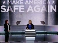 AP_16201044729094 Immigration reform advocate Mary Ann Mendoza speaks about her son as Jamiel Shaw and Sabine Durden, L-R, listen during the opening day of the Republican National Convention in Cleveland, Monday, July 18, 2016. (