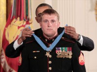 President Barack Obama awards the Medal of Honor to former Marine Corps Cpl. Dakota Meyer, 23, from Greensburg, Ky., Thursday, Sept. 15, 2011, during a ceremony in the East Room of the White House in Washington. Cpl. Meyer was in Afghanistan's Kunar province in Sept. 2009 when he repeatedly ran through enemy fire to recover the bodies of fellow American troops. He is the first living Marine to be awarded the Medal of Honor for actions in Iraq or Afghanistan. (AP Photo/Pablo Martinez Monsivais)