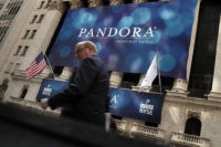 NEW YORK, NY - JUNE 15:  A banner for Pandora Media Inc., the online-radio company, hangs in front of the New York Stock Exchange walk on its first day of trading as a public company on June 15, 2011 in New York City. Pandora stock rose as much as 63 percent to $26 following its debut on the New York Stock Exchange, under the symbol P. Reversing much of the previous day's gains, stocks fell Wednesday as more news emerged about the fragility of the American and global economy. The Dow Jones Industrial Average fell 88 points, or 0.8%, to 11987 in morning trading.  (Photo by Spencer Platt/Getty Images)
