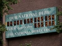The National Debt Clock, a billboard-size digital display showing the increasing US debt, is seen on the corner of Sixth Avenue and West 44th Street on August 1, 2011 in New York City.