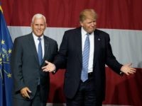 Republican presidential candidate Donald Trump (R) and Indiana Governor Mike Pence (L) take the stage during a campaign rally at Grant Park Event Center in Westfield, Indiana, on July 12, 2016. / AFP / Tasos KATOPODIS (Photo credit should read