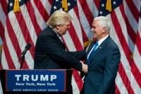 NEW YORK, NY - JULY 16: (L to R) Republican presidential candidate Donald Trump shakes hands with his newly selected vice presidential running mate Mike Pence, governor of Indiana, during an event at the Hilton Midtown Hotel, July 16, 2016 in New York City. On Friday, Trump announced on Twitter that he chose Pence to be his running mate. (Photo by Drew Angerer/Getty Images)
