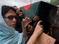 Relatives of a Bangladeshi police officer who was killed during a bloody siege carry his coffin during a memorial service in Dhaka on July 4, 2016.
Bangladesh said July 3 the attackers who slaughtered 20 hostages at a restaurant on July 1 were well-educated followers of a homegrown militant outfit who found extremism "fashionable", denying links to the Islamic State group. As the country held services to mourn the victims of the siege in Dhaka, details emerged of how the attackers spared the lives of Muslims while herding foreigners to their deaths.
 / AFP / ROBERTO SCHMIDT        (Photo credit should read ROBERTO SCHMIDT/AFP/Getty Images)