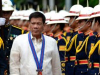 Philippine President Rodrigo Duterte walks past honour guards before Philippine National Police (PNP) chief Ronald Bato Dela Rosa's Assumption of Command Ceremony at the Camp Crame in Manila on July 1, 2016. Authoritarian firebrand Rodrigo Duterte was sworn in as the Philippines' president on June 30, after promising a ruthless and deeply controversial war on crime would be the main focus of his six-year term. / AFP / NOEL CELIS (Photo credit should read NOEL CELIS/AFP/Getty Images)
