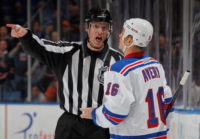UNIONDALE, NY - NOVEMBER 15: Linesman Brian Murphy #93 penalizes Sean Avery #16 of the New York Rangers 2 minutes for unsportsmanlike conduct during the game against the New York Islanders at Nassau Veterans Memorial Coliseum on November 15, 2011 in Uniondale, New York.  (Photo by Mike Stobe/NHLI via Getty Images)