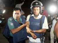 BANGLADESH, Dhaka : An injured policeman is escorted away by his colleague after an attack in Dhaka, Bangladesh, July 2, 2016. Gunmen have shot dead two police officials, police said, in the first attack on a foreign restaurant in Bangladesh claimed by Islamic State (IS) group jihadists. The gunmen stormed the restaurant in Bangladesh capital Dhaka's diplomatic enclave Gulshan on Friday night at about 9:00 p.m. local time. At least 40 people including two more senior police officials were injured in the incident.