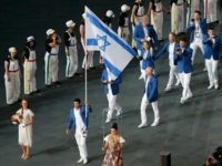 LONDON, ENGLAND - JULY 27: Israel's flagbearer Shahar Zubari holds the national flag as he leads the contingent in the athletes parade during the opening ceremony of the London 2012 Olympic Games at the Olympic Stadium on July 27, 2012 in London, England. (Photo by Fabrizio Bensch - IOPP Pool /Getty Images)