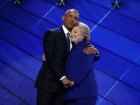 U.S. President Barack Obama hugs Hillary Clinton, 2016 Democratic presidential nominee, on stage during the Democratic National Convention (DNC) in Philadelphia, Pennsylvania, U.S., on Wednesday, July 27, 2016. With the historic nomination for the first woman to run as the presidential candidate of a major U.S. political party, Democrats gathered in Philadelphia hoped they had turned a corner on Tuesday. Photographer: Andrew Harrer/Bloomberg via Getty Images