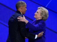 US Democratic presidential nominee Hillary Clinton embraces President Barack Obama on stage during the Democratic National Convention at the Wells Fargo Center in Philadelphia, Pennsylvania on July 27, 2016