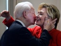 FILE - In this July 26, 2004 file photo, Sen. Hillary Clinton, D-NY, is embraced by Sen. Robert Byrd, D-W.Va., at a bookstore in New York where they were launching his book "Losing America: Confronting a Reckless and Arrogant Presidency." Just hours before she was to speak at the Democratic National Convention in Boston, Clinton introduced Byrd as her mentor and told the audience that he has been a champion of the U.S. Constitution.  Byrd a fiery orator versed in the classics and a hard-charging power broker who steered billions of federal dollars to the state of his Depression-era upbringing, died Monday, June 28, 2010.   (AP Photo/Bebeto Matthews, File)