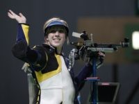 Virginia Thrasher of the United States celebrates winning a shootout to secure the gold medal in the Women's 10m Air Rifle event at Olympic Shooting Center at the 2016 Summer Olympics in Rio de Janeiro, Brazil, Saturday, Aug. 6, 2016. (AP Photo/Hassan Ammar)