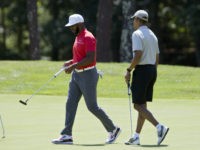 In this Aug. 7, 2016, photo, President Barack Obama and Los Angeles Clippers point guard Chris Paul walk on the first green during a round of golf at Farm Neck Golf Course in Oak Bluffs, Mass., on Martha's Vineyard. When Obama goes on vacation, he plays a lot of golf. And he likes to hang out with big-name basketball players. In his first outing, Obama joined up with Chris Paul of the Los Angeles Clippers. In the second round, it was Stephen Curry of the Golden State Warriors, and in his third and fourth rounds, Obama’s foursome included former stars Alonzo Mourning and Ray Allen.  (AP Photo/Manuel Balce Ceneta)
