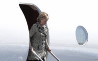 Democratic presidential candidate Hillary Clinton arrives on her campaign plane at Nantucket Memorial Airport in Nantucket, Mass., Saturday, Aug. 20, 2016., en route to a fundraiser. (AP Photo/Carolyn Kaster)
