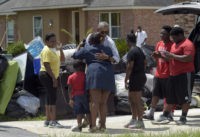 President Barack Obama greets residents as he tours Castle Place, a flood-damaged area of Baton Rouge, La., Tuesday, Aug. 23, 2016. Obama is making his first visit to flood-ravaged southern Louisiana as he attempts to assure the many thousands who have suffered damage to their homes, schools and businesses that his administration has made their recovery a priority. (AP Photo/Susan Walsh)