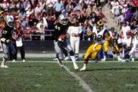 LOS ANGELES - DECEMBER 18:  Defensive end Burgess Owens #44 of the Los Angeles Raiders runs with the ball past wide receiver Willie Miller #82 of the Los Angeles Rams during the game at the Los Angeles Memorial Coliseum on December 18, 1982 in Los Angeles, California.  The Raiders won 37-31.  (Photo by George Rose/Getty Images)