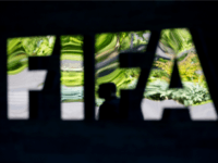 ZURICH, SWITZERLAND - JUNE 03: A FIFA logo sits next to the entrance at the FIFA headquarters on June 3, 2015 in Zurich, Switzerland. Joseph S. Blatter resigned as president of FIFA. The 79-year-old Swiss official, FIFA president for 17 years said a special congress would be called to elect a successor. (Photo by Philipp Schmidli/Getty Images)