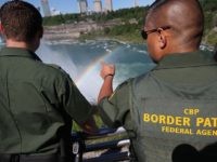 NIAGARA FALLS, NY - JUNE 04:  A rainbow forms in the mist of Niagara Falls as U.S. Border Patrol agents patrol the area on June 4, 2013 in Niagara Falls, New York. The major tourist attraction, which falls directly on the U.S.-Canada border, is a major destination for international visitors. Border Patrol agents detain travelers who have overstayed their visas as well as undocumented immigrants who attempt to illegally cross the international bridge in Niagara Falls.  (Photo by John Moore/Getty Images)