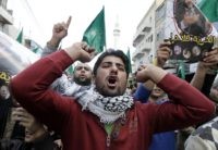 Supporters of the Muslim Brotherhood in Jordan shout slogans during a demonstration in the capital Amman on November 28, 2014, against Israeli "violations" regarding the Al-Aqsa mosque compound in east Jerusalem. The tensions soared earlier this month when Israeli police entered the Al-Aqsa mosque compound during clashes triggered by a vow by far-right Jewish groups to pray at the holy site. AFP PHOTO / KHALIL MAZRAAWI        (Photo credit should read KHALIL MAZRAAWI/AFP/Getty Images)