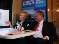 : Democratic presidential nominee former Secretary of State Hillary Clinton (L) and democratic vice presidential nominee U.S. Sen Tim Kaine (D-VA) (R) sit on their campaign bus after attending church services Amani Temple Ministries on July 31, 2016 in Cleveland, Ohio. Hillary Clinton and Tim Kaine are wrapping up their three-day bus tour through Pennsylvania and Ohio. (Photo by