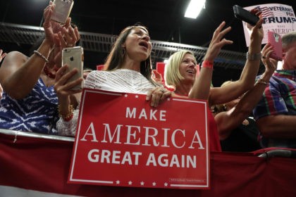 FREDERICKSBURG, VA - AUGUST 20: Supporters hold signs during a campaign rally of Republican presidential nominee Donald Trump at Fredericksburg Expo Center August 20, 2016 in Fredericksburg, Virginia. Trump continues to campaign for the November presidential election with polls showing that he is trailing in many swing states, including Virginia. (Photo by Alex Wong/Getty Images)