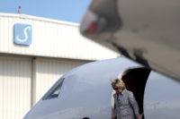 LOS ANGELES, CA - AUGUST 22:  Democratic presidential nominee former Secretary of State Hillary Clinton walks off of her plane at Van Nuys Airport on August 22, 2016 in Van Nuys, California. Hillary Clinton is attending fundraisers in California.  (Photo by Justin Sullivan/Getty Images)