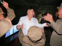 This undated picture released from North Korea's official Korean Central News Agency (KCNA) on August 25, 2016 shows North Korean leader Kim Jong-Un (C) laughing as he inspects a test-fire of strategic submarine-launched ballistic missile at an undisclosed location. / AFP / KCNA / KNS / South Korea OUT / REPUBLIC OF KOREA OUT  / SOUTH KOREA OUT ---EDITORS NOTE--- RESTRICTED TO EDITORIAL USE - MANDATORY CREDIT "AFP PHOTO/KCNA VIA KNS" - NO MARKETING NO ADVERTISING CAMPAIGNS - DISTRIBUTED AS A SERVICE TO CLIENTS
THIS PICTURE WAS MADE AVAILABLE BY A THIRD PARTY. AFP CAN NOT INDEPENDENTLY VERIFY THE AUTHENTICITY, LOCATION, DATE AND CONTENT OF THIS IMAGE. THIS PHOTO IS DISTRIBUTED EXACTLY AS RECEIVED BY AFP.  /         (Photo credit should read KNS/AFP/Getty Images)