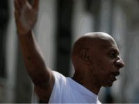 Cuba's dissident Guillermo Farinas speaks with an unidentified man outside his home in Santa Clara, Cuba, Friday, Jan. 28, 2011. Farinas was released by Cuban authorities after being detained for a second time on Thursday afternoon. (AP Photo/Javier Galeano)