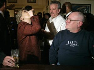 Democratic presidential hopeful ,Sen. Hillary Rodham Clinton, D-N.Y., tosses back a shot of Crown Royal with Bronko's owner Nick Tarailo, second from right, and Ed Hall, right as she stops at the bar during a campaign stop at Bronko's restaurant in Crown Point, Ind., on Saturday, April 12, 2008. (AP Photo/Carolyn Kaster) 