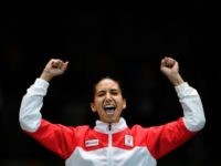 Tunisia's bronze medallist Ines Boubakri celebrates on the podium during the medal ceremony for the women's individual foil fencing event of the Rio 2016 Olympic Games at the Carioca Arena 3 in Rio de Janeiro on August 10, 2016. / AFP / Fabrice COFFRINI (Photo credit should read FABRICE COFFRINI/AFP/Getty Images)