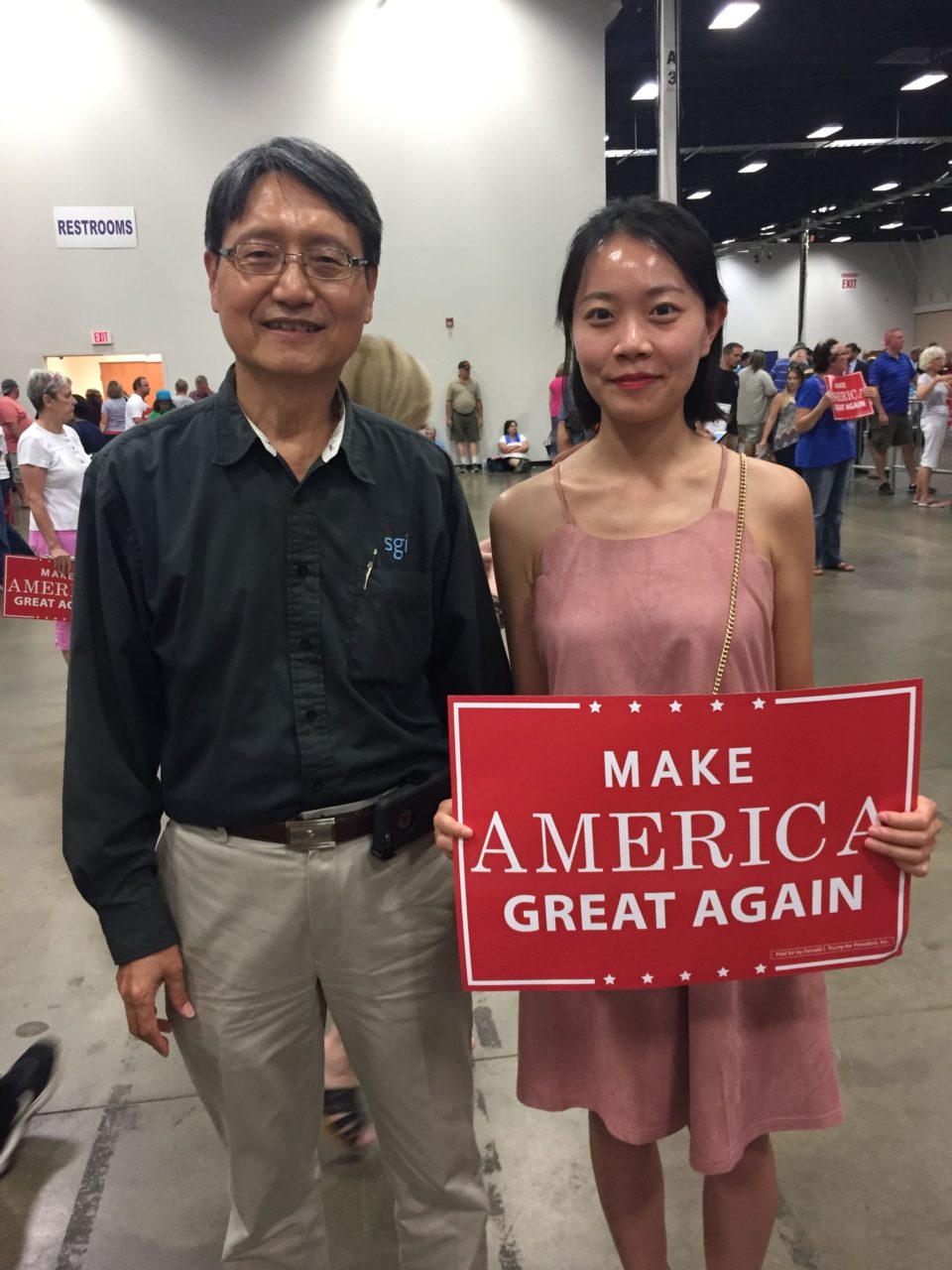 Man and his daughter at rally