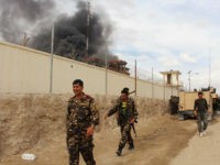 FILE -- In this March 9, 2016 file photo, smoke rises from a building, where Taliban insurgents hide during a fire fight with Afghan security forces, in Helmand province, south west Afghanistan. Kareem Atal, head of the provincial council, said Wednesday, Aug. 10, 2016, that troops are being deployed to a key southern city in Helmand province where fighting is raging with the Taliban to ensure it does not fall to the insurgents. Helmand is a strategically important province for both the Kabul government and the Taliban, whose insurgency is now in its 15th year. (AP Photo, File)