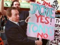 omedian Jackie Mason holds a sign protesting against the Tony Awards outside the award ceremony 02 June in New York. Mason who appears in his own comedy show on Broadway entitled 'Love Thy Neighbor' was not nominated for an award as the Tony Committe does not recognise his one-man-show as a play. (Photo credit should read JON LEVY/AFP/Getty Images)
