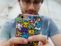 A player's phone is decorated with Pokemon stickers as he plays Pokemon Go, a mobile game that has become a global phenomenon, the day after it's UK release on July 15, 2016 in London, England. The app lets players roam using their phone's GPS location data and catch Pokemon to train and battle.The game has added millions to the value of Nintendo, which part-owns the franchise. (Photo by Olivia Harris/Getty Images)