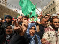 Mourners, including his mother (C), carry the body of Qassem Abu Ouda, a Palestinian who was shot dead following reported attacks on Israelis, during his funeral on March 15, 2016 in the West Bank town of Hebron. Three Palestinians, Qassem Abu Ouda, 30, and Amir Juneidi, 22, from Hebron, and Yousef Taraya, 18, from the nearby village of Bani Naim, carried out two attacks on March 14, 2016 -- a shooting and a car-ramming -- on Israelis at the entrance of Kiryat Arba (near Hebron) before they were shot dead, the Israeli army said. / AFP / HAZEM BADER (Photo credit should read HAZEM BADER/AFP/Getty Images)