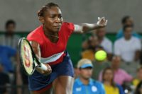Four-time gold medallist Venus Williams, suffering with a virus, slumped to her first ever opening round loss to Belgium's Kirsten Flipkens at an Olympic Games