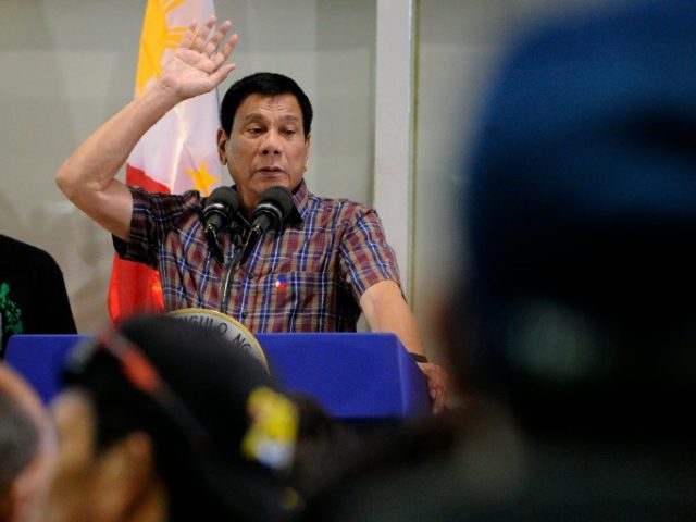 Philippines President Rodrigo Duterte speaksd uring a welcoming ceremony for repatriated overseas Filipino workers (OFW) from Saudi Arabia at the Manila International Airport in Manila on August 31, 2016