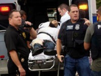 Ahmad Khan Rahami is taken into custody after a shootout with police Monday, Sept. 19, 2016, in Linden, N.J. Rahami was wanted for questioning in the bombings that rocked the Chelsea neighborhood of New York and the New Jersey shore town of Seaside Park. (Nicolaus Czarnecki/Boston Herald via AP)