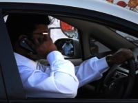 Cell phone driver (Dibyangshu Sarkar / AFP / Getty)