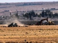 This picture taken on September 4, 2016 at Elbeyli, in the southern region of Kilis, shows Turkish tank coming from Syria during clashes betweenTurkish army and ISIS militants. Ankara stepped up its fight against militants in Turkey and northern Syria with air strikes on Kurdish rebel positions in the restive southeast and IS extremists in northern Syria, security sources said on September 4, 2016. / AFP / BULENT KILIC (Photo credit should read
