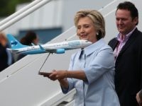 Democratic presidential nominee former Secretary of State Hillary Clinton looks at a scale model of her new campaign plane at Westchester County Airport on September 5, 2016 in White Plains, New York.
